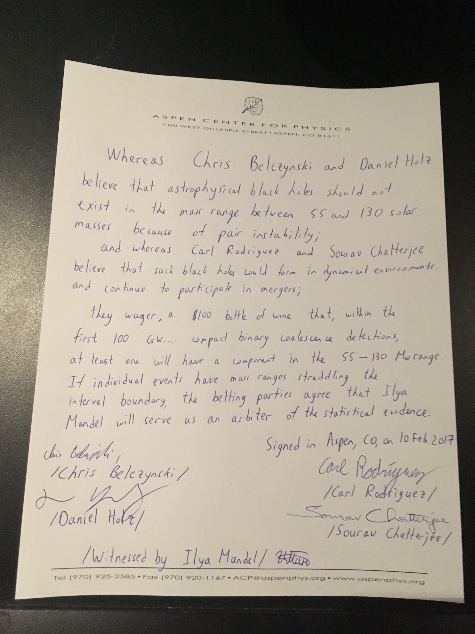 Handwritten bet between Chris Belczynski/Dan Holz and Carl Rodriguez/Sourav Chatterjee, wagering a $100 bottle of wine that within the first 100 gravitational wave detections, one black hole will lie in the 55-130 solar mass range.